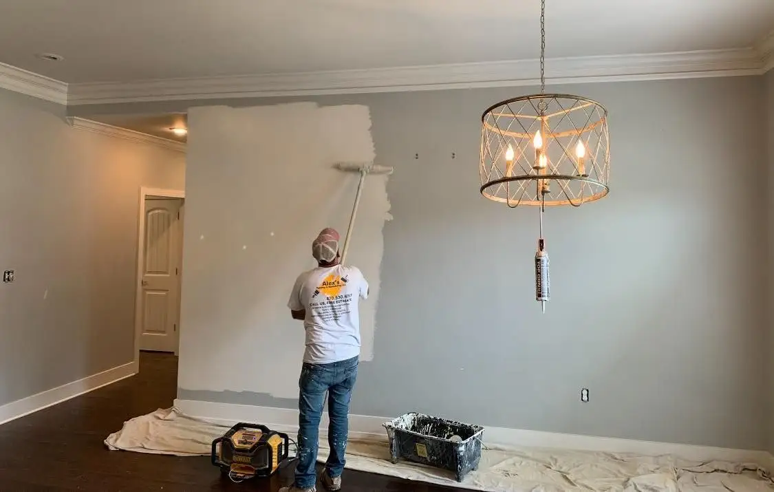 Freshly painted interior with crisp white trim and a soft neutral wall color by Alex's Painting & Remodeling.