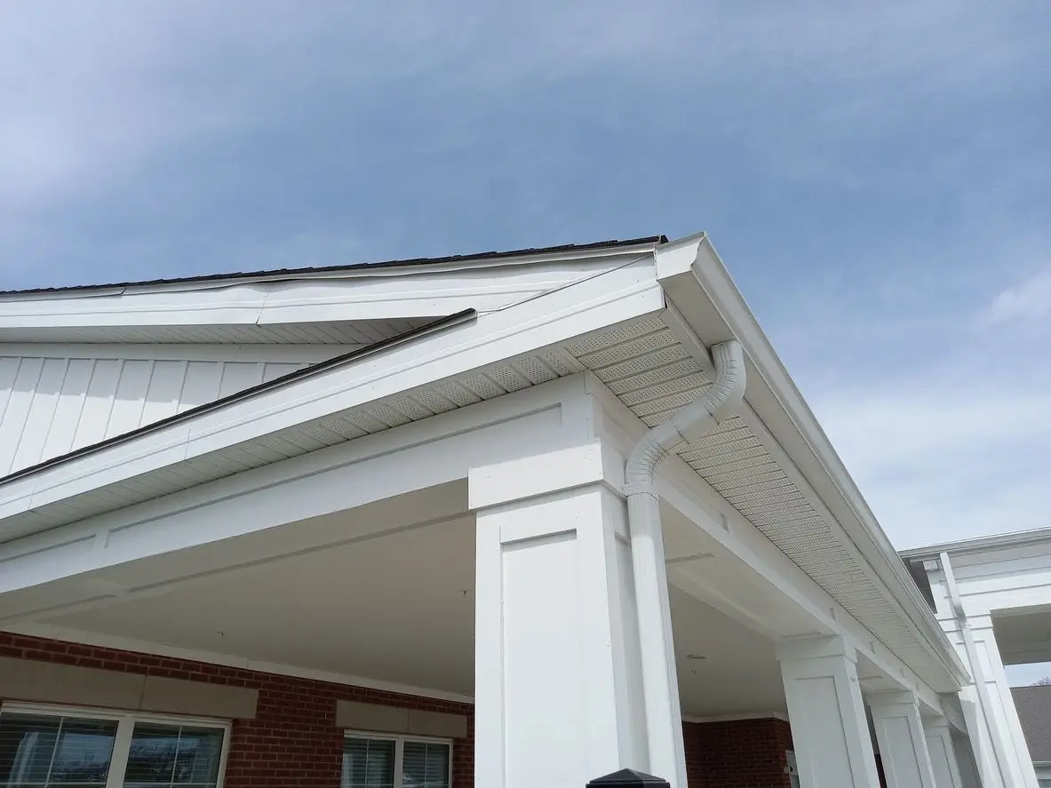 Freshly painted white home with new gutters in Jonesboro, AR.